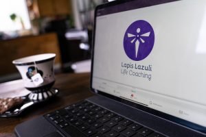 ipad pro screen with purple logo and teacup